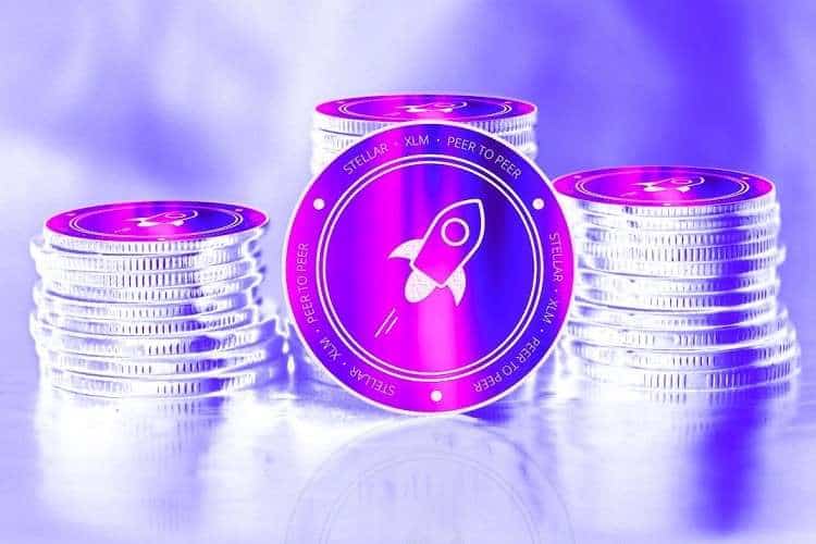 stellar lumen xlm crypto coin in front of a stack of coins